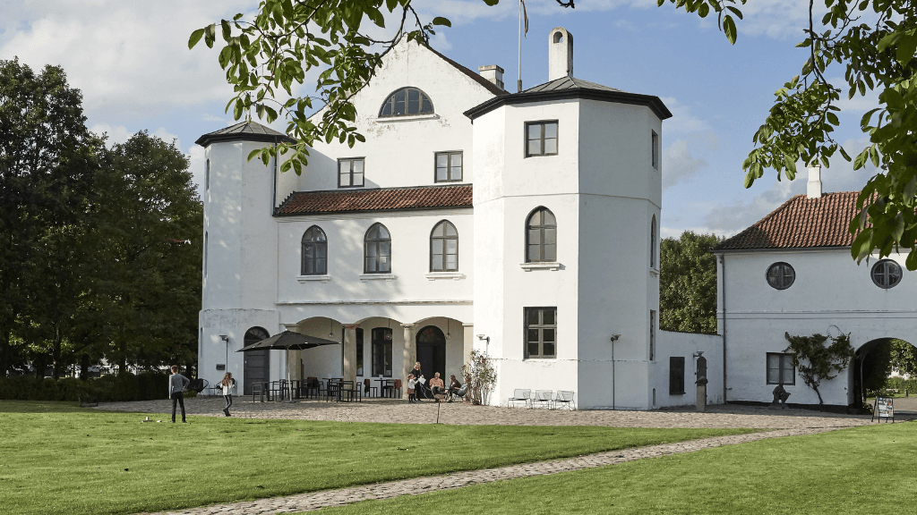 White castle seen from the green castle garden on a Summers day